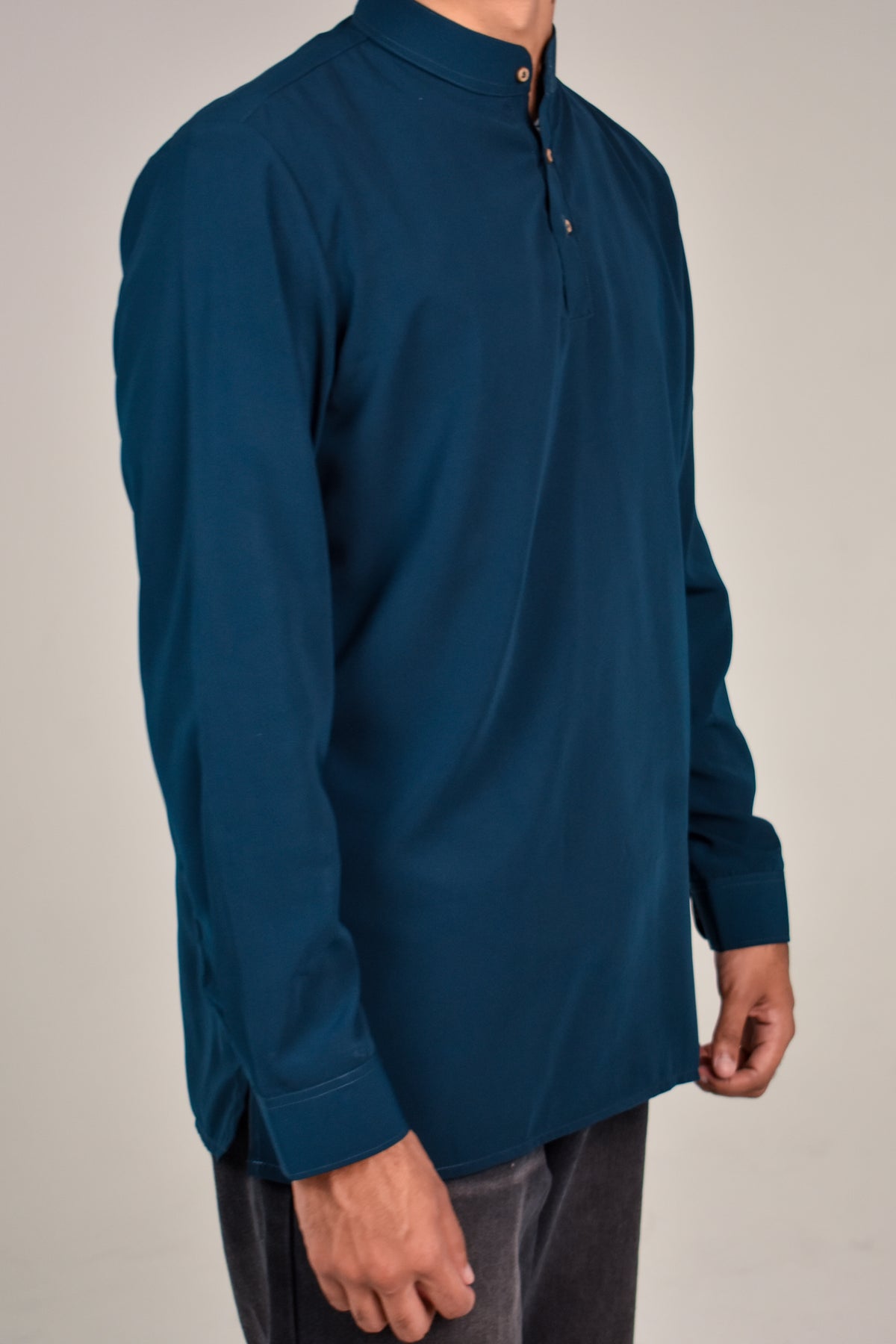 Rawi Short Kurta in Smooth Finish, Teal, angled side view worn