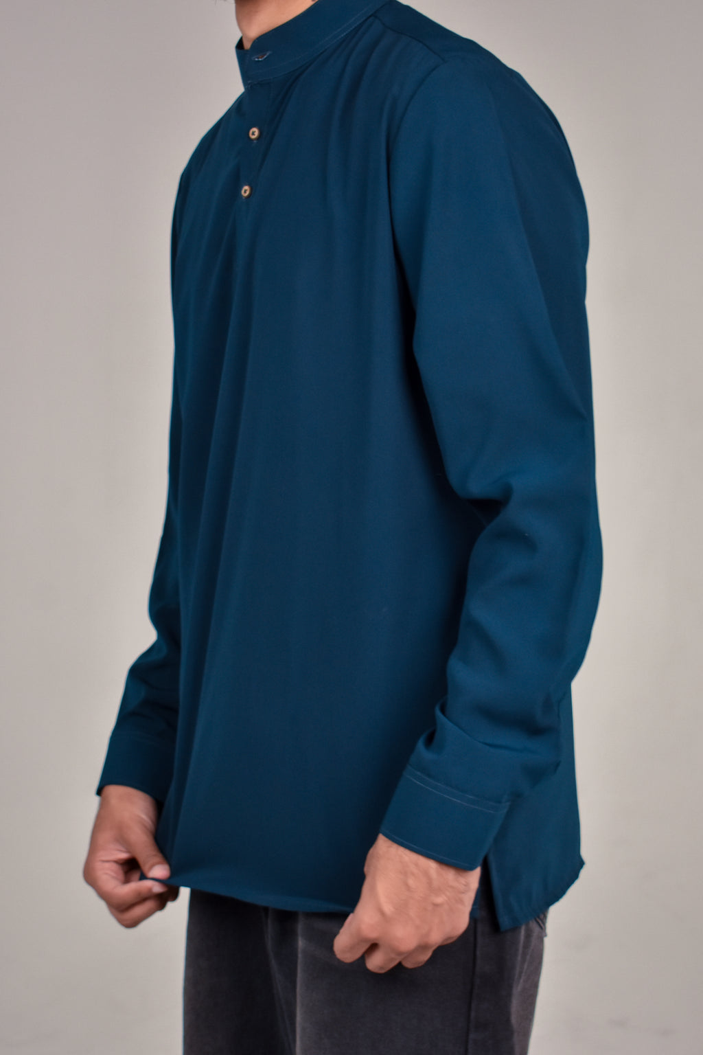 Rawi Short Kurta in Smooth Finish, Teal, angled view showing hem and side slit