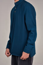 Rawi Short Kurta in Smooth Finish, Teal, angled view showing hem and side slit