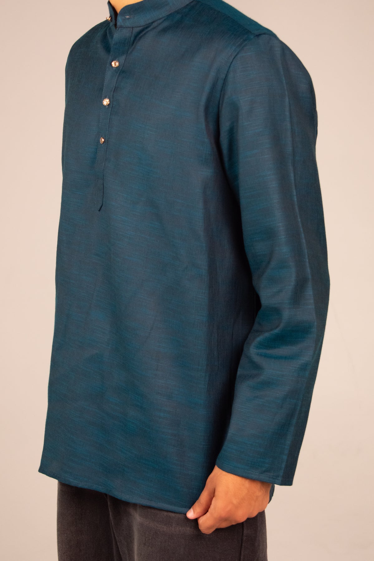 Rawi Short Kurta in Linen Blend, Teal, angled side view worn